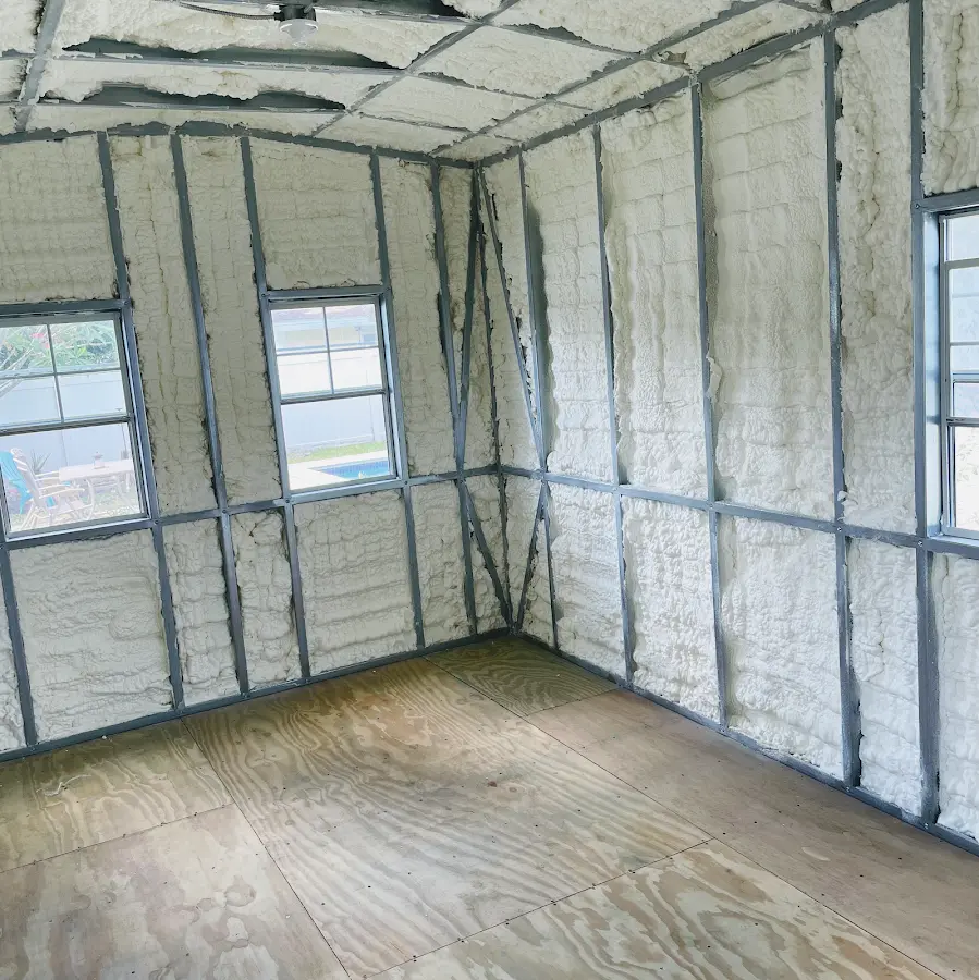 Closed-cell spray foam insulation applied to wall cavities in a residential project in Hondo